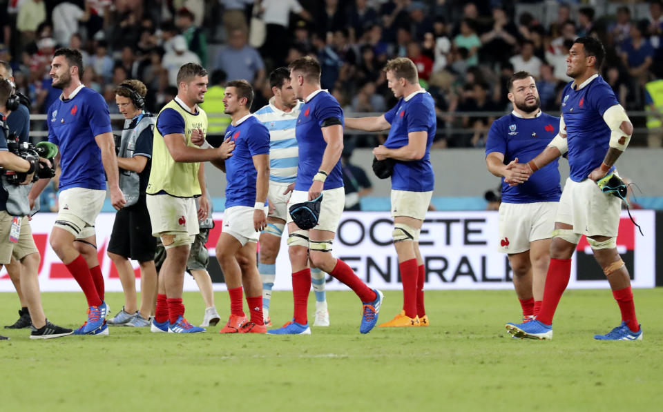 French players celebrate after defeating Argentina 23-21 in the Rugby World Cup Pool C game at Tokyo Stadium between France and Argentina in Tokyo, Japan, Saturday, Sept. 21, 2019. (AP Photo/Eugene Hoshiko)