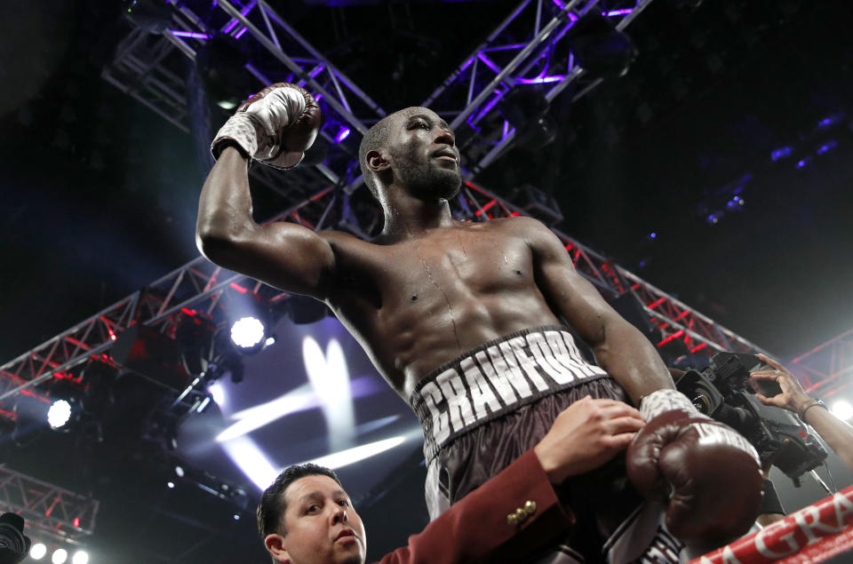 Terence Crawford celebrates after defeating Jeff Horn, of Australia, in a welterweight title boxing match, Saturday, June 9, 2018, in Las Vegas. (AP Photo)