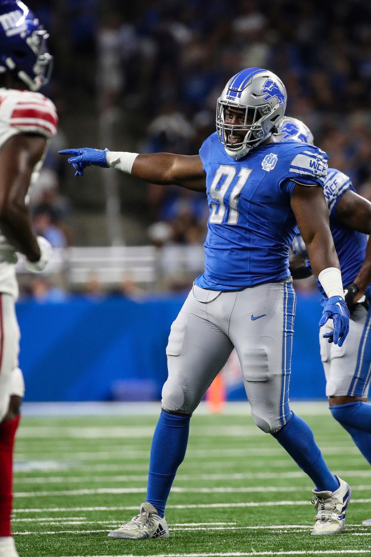 Detroit Lions defensive lineman Levi Onwuzurike celebrates a tackle against the New York Giants during the first half of a preseason game at Ford Field in Detroit on Friday, Aug. 11, 2023.