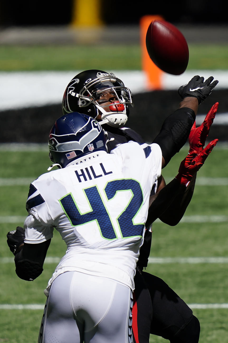 Atlanta Falcons wide receiver Julio Jones (11) prepares to make a catch against Seattle Seahawks safety Lano Hill (42) during the second half of an NFL football game, Sunday, Sept. 13, 2020, in Atlanta. (AP Photo/Brynn Anderson)