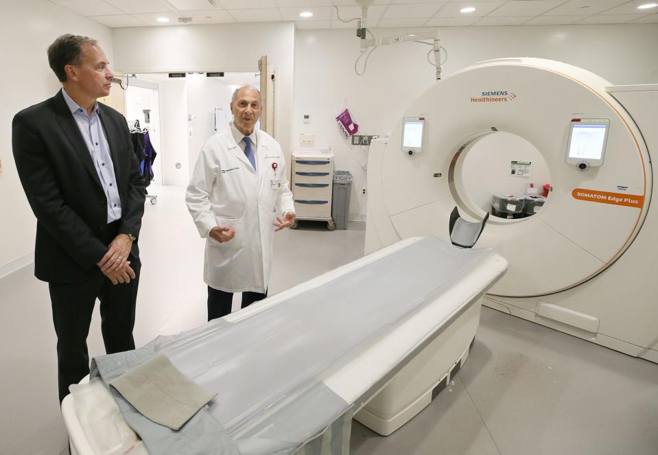 Dr. Steven Brooks, department chair of emergency medicine at Cleveland Clinic Akron General, and Dr. Farid Muakkassa, head of trauma, talk about treating gunshot wounds and dealing with issues that can accompany shootings while in the CAT scan room in the hospital's ER.