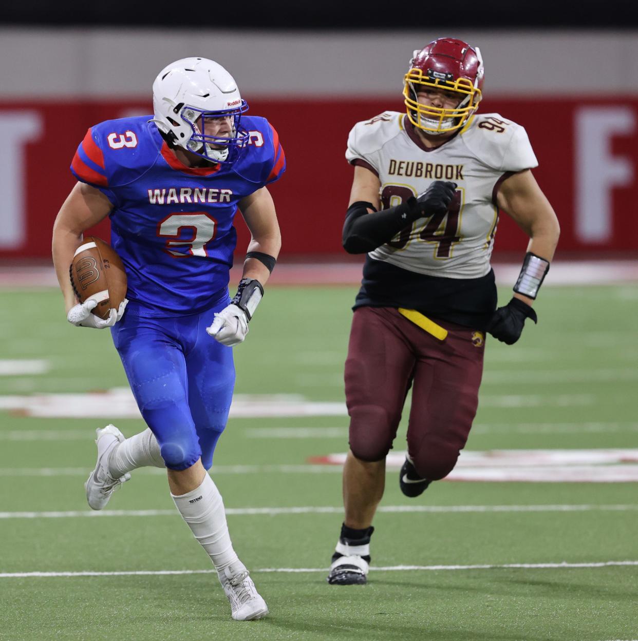 Warner's Brodey Sauerwein (3) is chased by Deubrook Area's Dylan Rios during the state Class 9A football championship on Thursday, Nov. 9, 2023 in Vermillion's DakotaDome. Warner won 76-54.