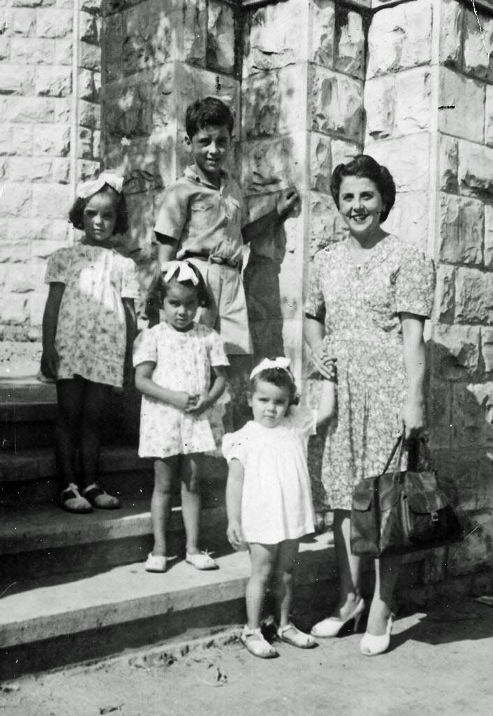 Joumana Asfour's great-grandmother and grandmother and her grandmother's siblings outside their house in Haifa, Palestine, before the Nakba.