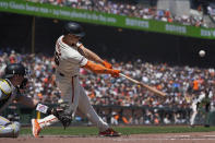 San Francisco Giants' Matt Chapman hits a single against the Pittsburgh Pirates during the third inning of a baseball game Sunday, April 28, 2024, in San Francisco. (AP Photo/Godofredo A. Vásquez)