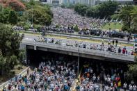 Thousands of opposition protesters tried to march on central Caracas, a pro-government bastion where supporters of President Nicolas Maduro had massed for a counter-demonstration