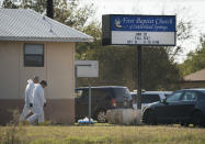 <p>Members of the FBI Hazardous Evidence Response Team walk next to the First Baptist Church of Sutherland Springs in response to a fatal shooting, Nov. 5, 2017, in Sutherland Springs, Texas. (Darren Abate/AP) </p>