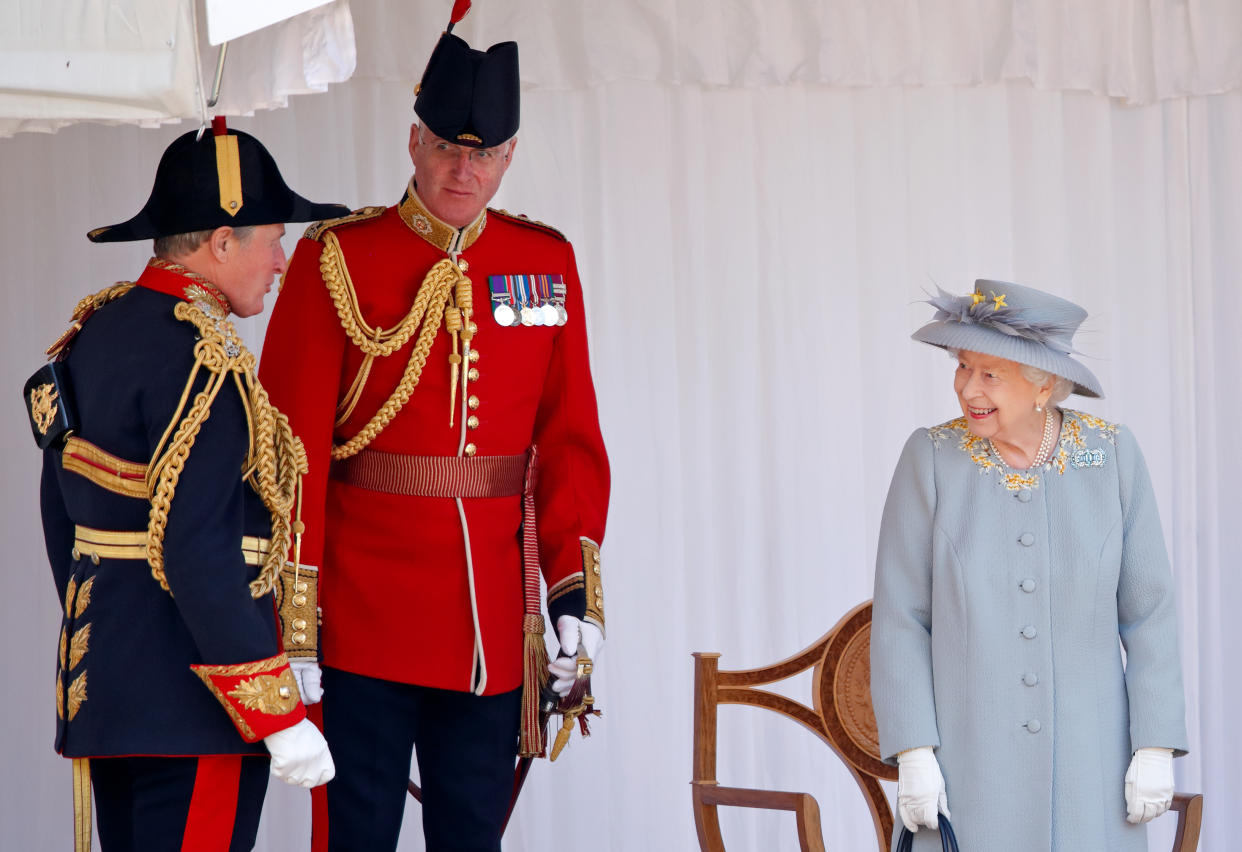 WINDSOR, UNITED KINGDOM - JUNE 12: (EMBARGOED FOR PUBLICATION IN UK NEWSPAPERS UNTIL 24 HOURS AFTER CREATE DATE AND TIME) Queen Elizabeth II talks with Crown Equerry Colonel Toby Browne (L) and Lieutenant Colonel Michael Vernon (Comptroller of the Lord Chamberlain's Office) as she attends a military parade, held by the Household Division (during which The Queen's Colour of F Company Scots Guards will be trooped) in the Quadrangle of Windsor Castle, to mark her Official Birthday on June 12, 2021 in Windsor, England. For the second consecutive year The Queen's Birthday Parade, known as Trooping the Colour, hasn't been able to go ahead in it's traditional form at Buckingham Palace and Horse Guards Parade due to the ongoing COVID-19 Pandemic. (Photo by Max Mumby/Indigo - Pool/Getty Images)