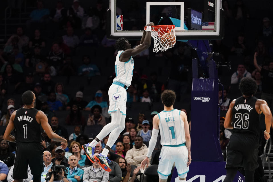 Charlotte Hornets forward JT Thor dunks the ball in the first half of an NBA basketball game against the Brooklyn Nets, Monday, Oct. 30, 2023, in Charlotte, N.C. (AP Photo/Erik Verduzco)