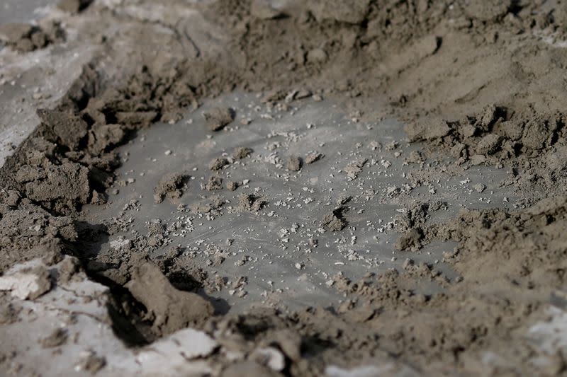 A hole is seen in the place where a plaque was placed by Thai pro-democracy protesters near the Grand Palace in Bangkok