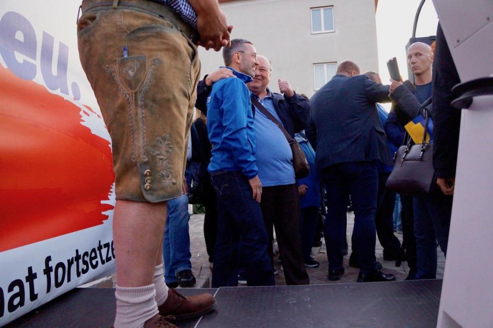 Freedom Party politician Herbert Kickl (center in blue jacket), a controversial former interior minister, at a September rally in Traisen, Austria.