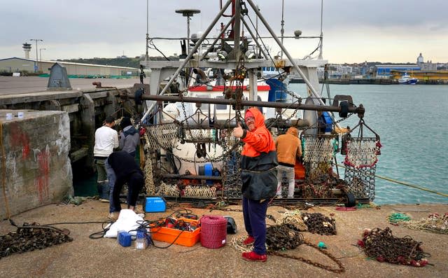 French fisherman Pierre Hagnerz prepares his boat for sea at the port of Boulogne as the cross-Channel fishing row continues