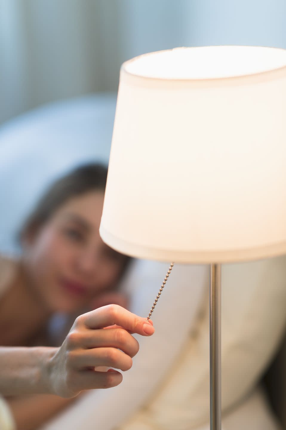 <p>"The light in traditional bulbs reacts with the cells in your eyes and tells your brain to stop producing melatonin, a hormone that your body makes to help regulate your sleep cycle," says <a href="https://thesleepdoctor.com/" rel="nofollow noopener" target="_blank" data-ylk="slk:Michael Breus;elm:context_link;itc:0;sec:content-canvas" class="link ">Michael Breus</a>, Ph.D., a sleep specialist in Scottsdale, AZ. That's why you should <a href="https://www.health.harvard.edu/staying-healthy/blue-light-has-a-dark-side" rel="nofollow noopener" target="_blank" data-ylk="slk:consider a filtered lightbulb;elm:context_link;itc:0;sec:content-canvas" class="link ">consider a filtered lightbulb</a> without blue light, which has been linked to poor sleep quality, Harvard reports. </p><p><strong>What You'll Need:</strong> <a href="https://www.amazon.com/Bedtime-Low-Blue-Light-Healthy-Sleep/dp/B07H49N46N/?tag=syn-yahoo-20&ascsubtag=%5Bartid%7C2140.g.35366541%5Bsrc%7Cyahoo-us" rel="nofollow noopener" target="_blank" data-ylk="slk:Bedtime bulb;elm:context_link;itc:0;sec:content-canvas" class="link ">Bedtime bulb</a> ($20, Amazon)</p>