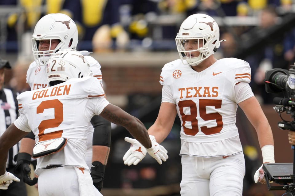 Texas tight end Gunnar Helm (85) celebrates his 21-yard touchdown reception against Michigan in the first half of an NCAA college football game in Ann Arbor, Michigan, Saturday, Sept. 7, 2024. (AP Photo/Paul Sancya)