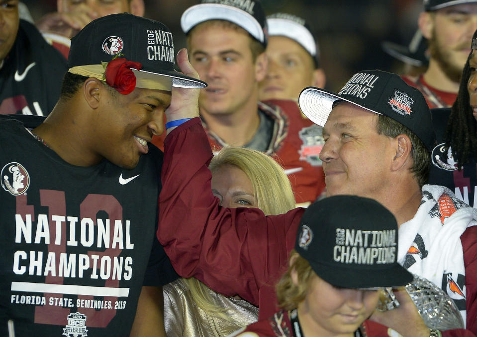 Florida State head coach Jimbo Fisher with Jameis Winston after the NCAA BCS National Championship college football game against Auburn Monday, Jan. 6, 2014, in Pasadena, Calif. Florida State won 34-31. (AP Photo/Mark J. Terrill)