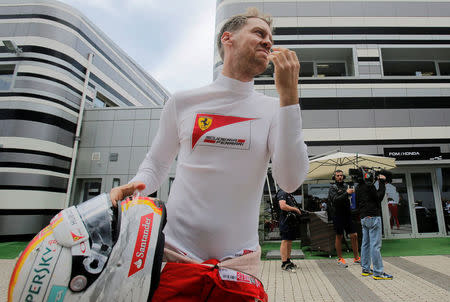 Formula One - Russian Grand Prix - Sochi, Russia - 30/4/16 - Ferrari F1 driver Sebastian Vettel of Germany walks to the garage before the third practice session. REUTERS/Maxim Shemetov