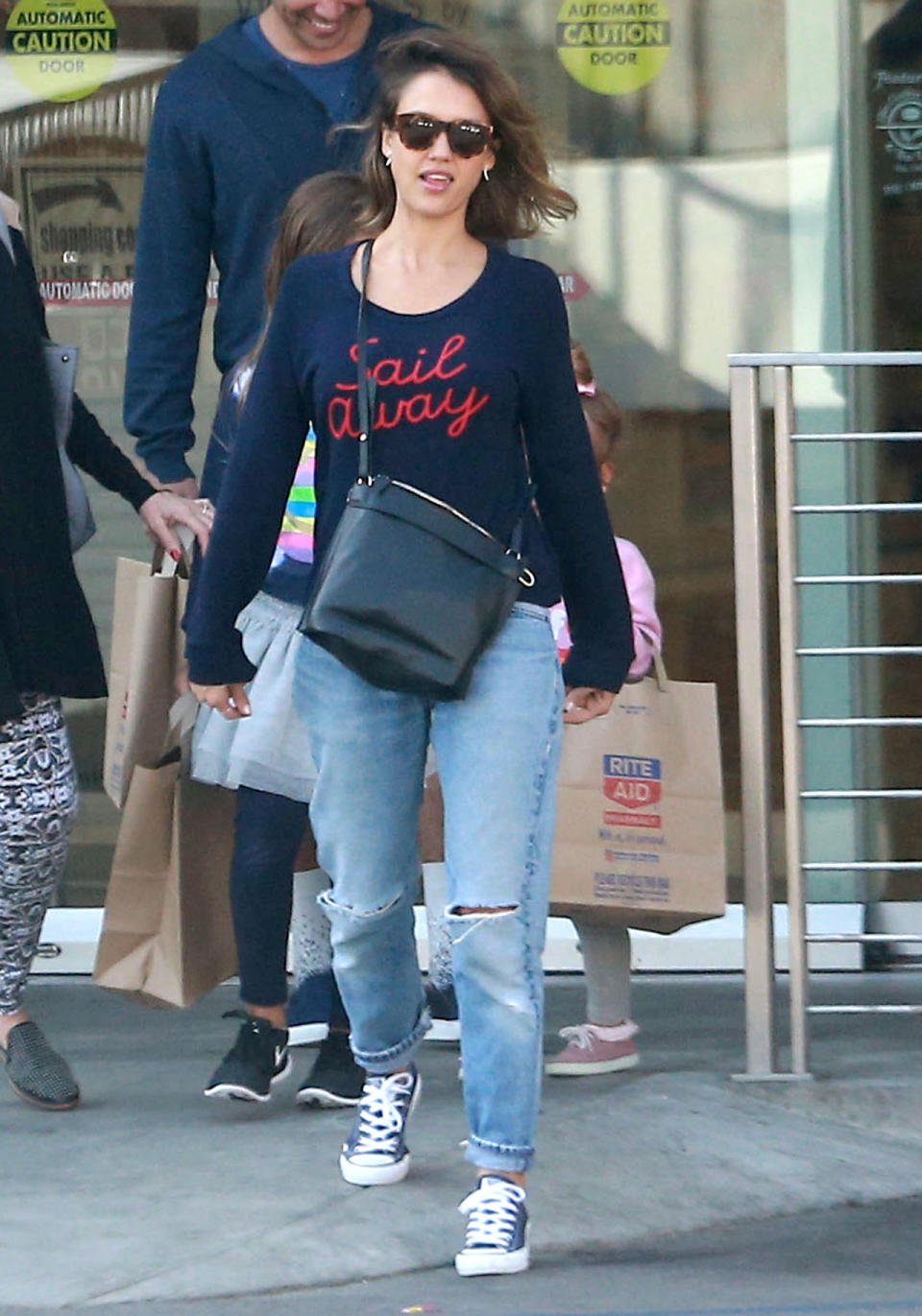 Jessica Alba in a navy “Sail Away” sweater.