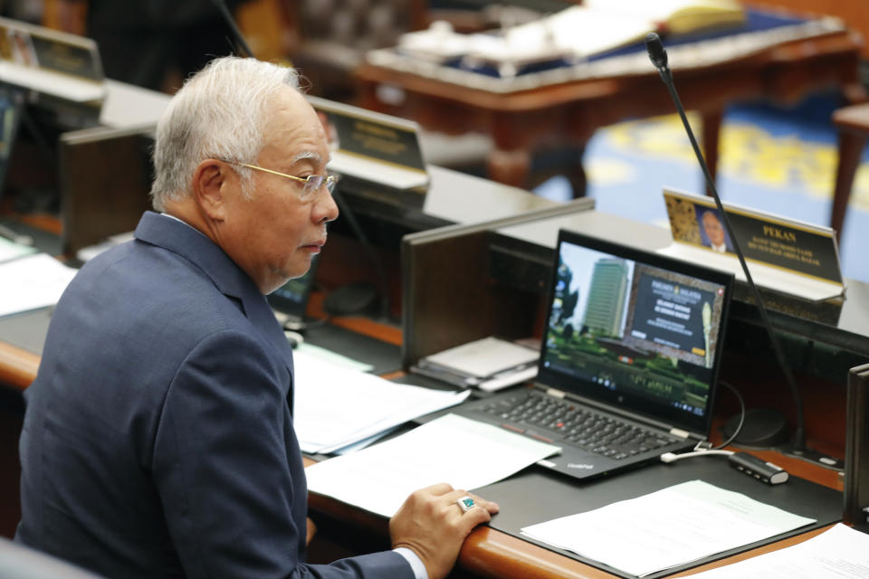 Malaysia's former Prime Minister Najib Razak attend the parliament session at parliament house in Kuala Lumpur, Monday, Oct. 15, 2018. (AP Photo/Vincent Thian)