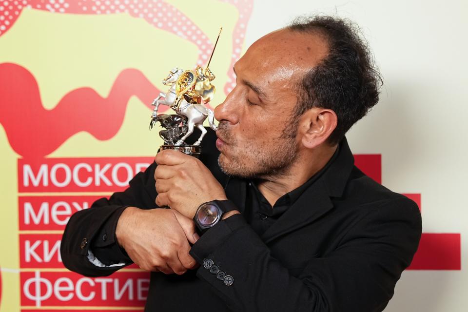 Mexican director Miguel Salgado poses with his the Golden Saint George trophy for a photo after the closing ceremony of the 46th Moscow International Film Festival in Moscow, Russia, on Friday, April 26, 2024. A Mexican film has won the top prize at the Moscow International Film Festival which took place as major Western studios boycott the Russian market and as Russia's war in Ukraine grinds into its third year. "Shame," a film by director Miguel Salgado and co-produced by Mexico and Qatar, was the most highly awarded film at the festival which began in 1935 and which has been held annually since 1999. (AP Photo/Alexander Zemlianichenko)