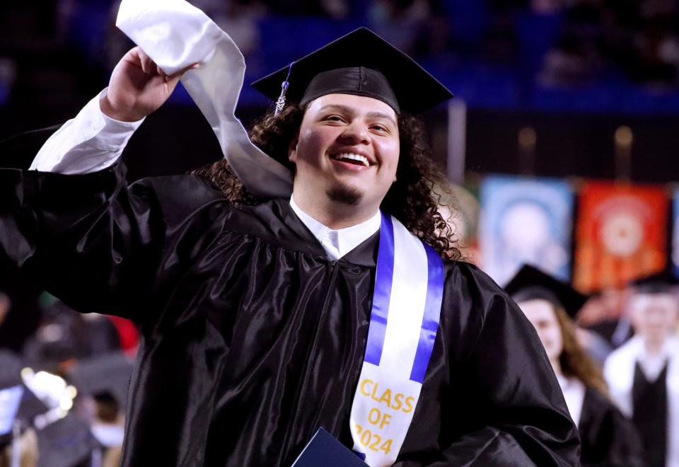MTSU graduate Justin Melgar celebrates as he heads back to his seat after crossing the stage during MTSU’s afternoon 2024 Spring Commencement ceremony at Murphy Center, on Saturday, May 4, 2024.