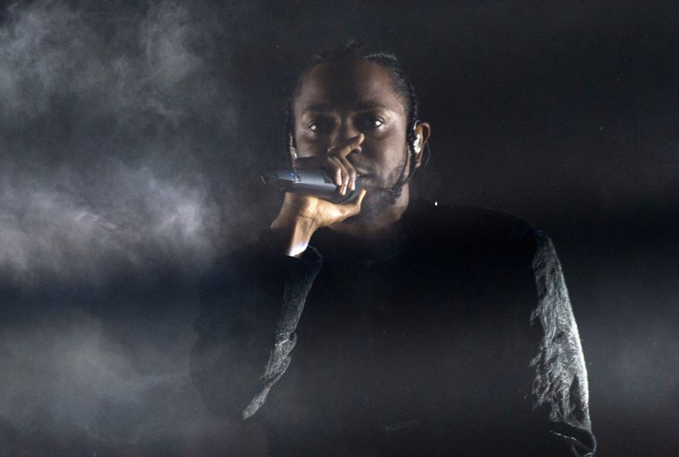 In this file photo taken on April 16, 2017 rapper Kendrick Lamar performs at the Coachella Valley Music And Arts Festival in Indio, California.