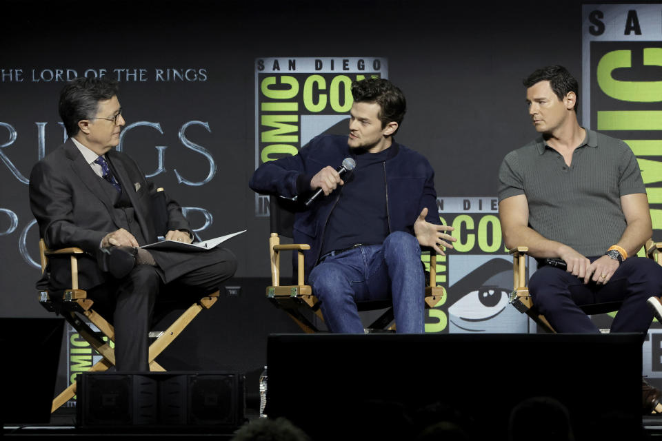 Stephen Colbert, Robert Aramayo (Elrond) and Benjamin Walker (High King Gil-galad) speak onstage at 
