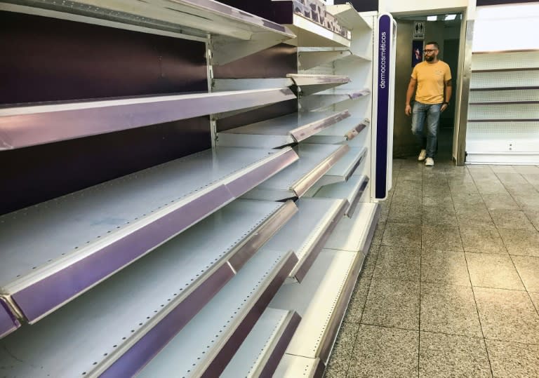 Empty supermarket shelves in Venezuela, which is facing a crippling food shortage