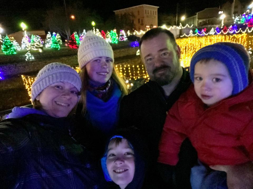 From left, exchange student host mother Amanda Garland of Adrian, exchange student Laura Rodzen of Poland, and Camden, Brandon and Mason Garland are pictured at the Comstock Christmas Riverwalk lighting in December 2021 in Adrian.