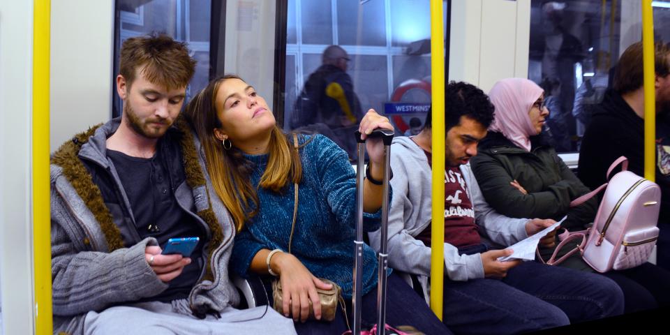 london tube train couple travel