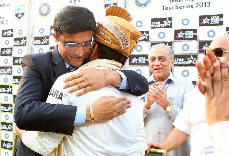 Saurav Ganguly hugs Sachin Tendulkar of India during day three of the first Star Sports test match between India and The West Indies held at The Eden Gardens Stadium in Kolkata, India on the 8th November 2013. (BCCI Photo)