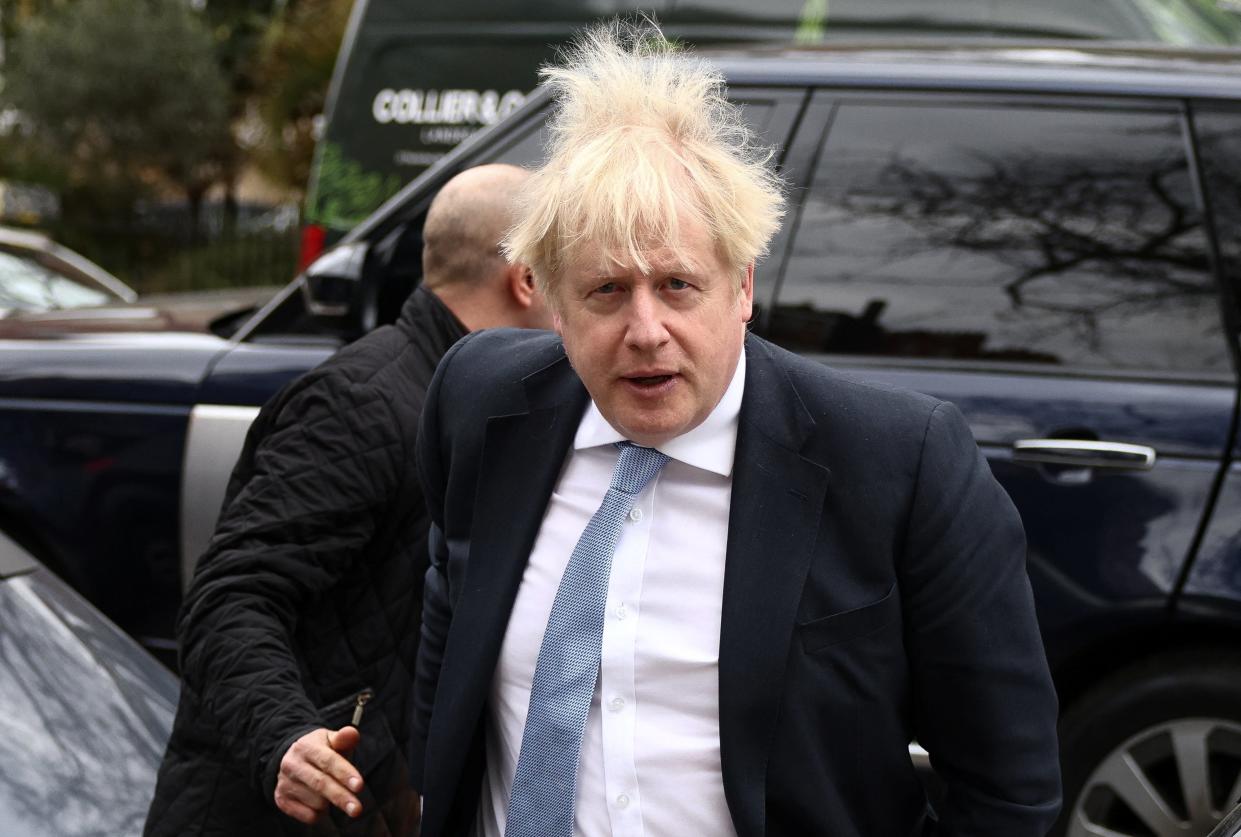 Boris Johnson arrives at a residence in London today (REUTERS)