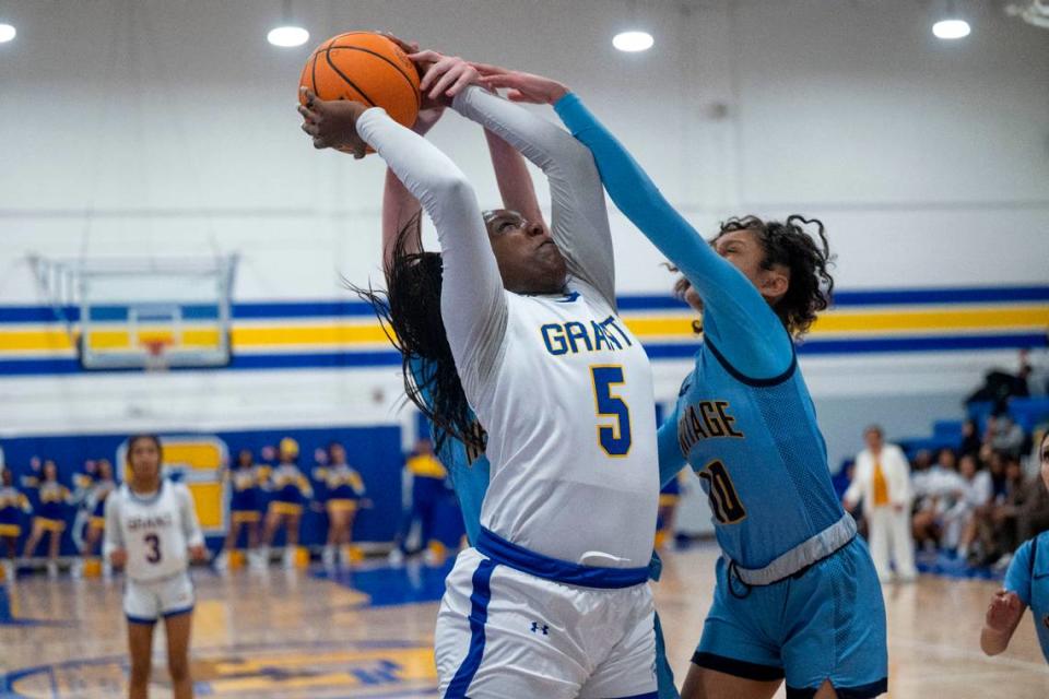 Grant High School’s Samaya Dillard (5) is fouled by a Heritage High School defender in the CIF Northern California regional Division III girls basketball playoff game in February. Dillard will play for the North large-schools team.