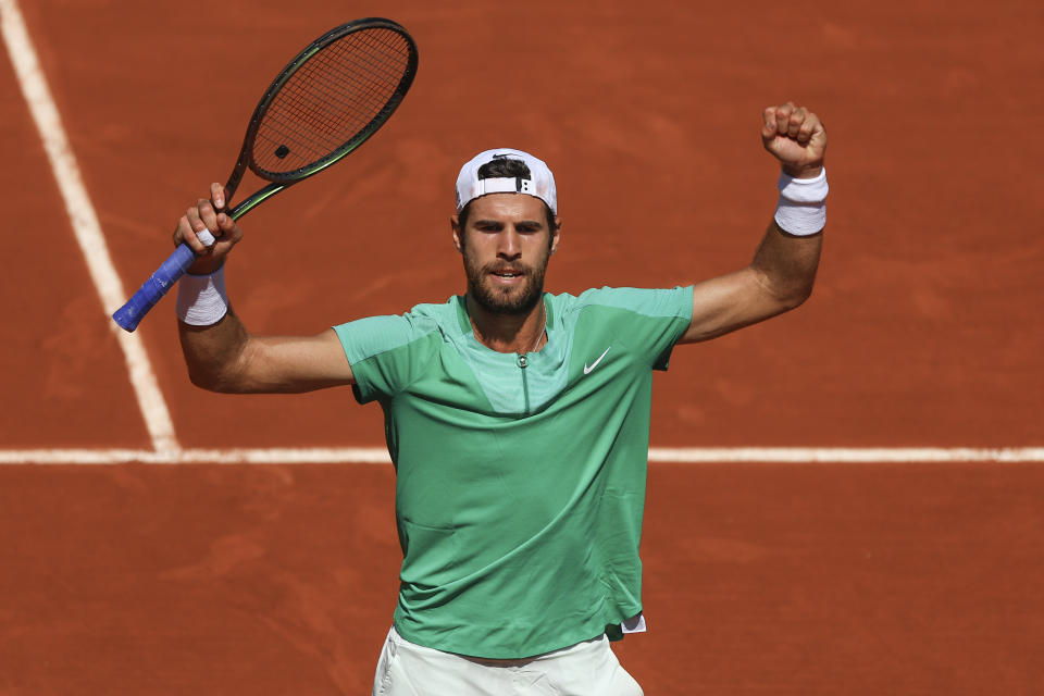 Russia's Karen Khachanov celebrates after winning against France's Constant Lestienne during their first round match of the French Open tennis tournament at the Roland Garros stadium in Paris, Sunday, May 28, 2023. (AP Photo/Aurelien Morissard)