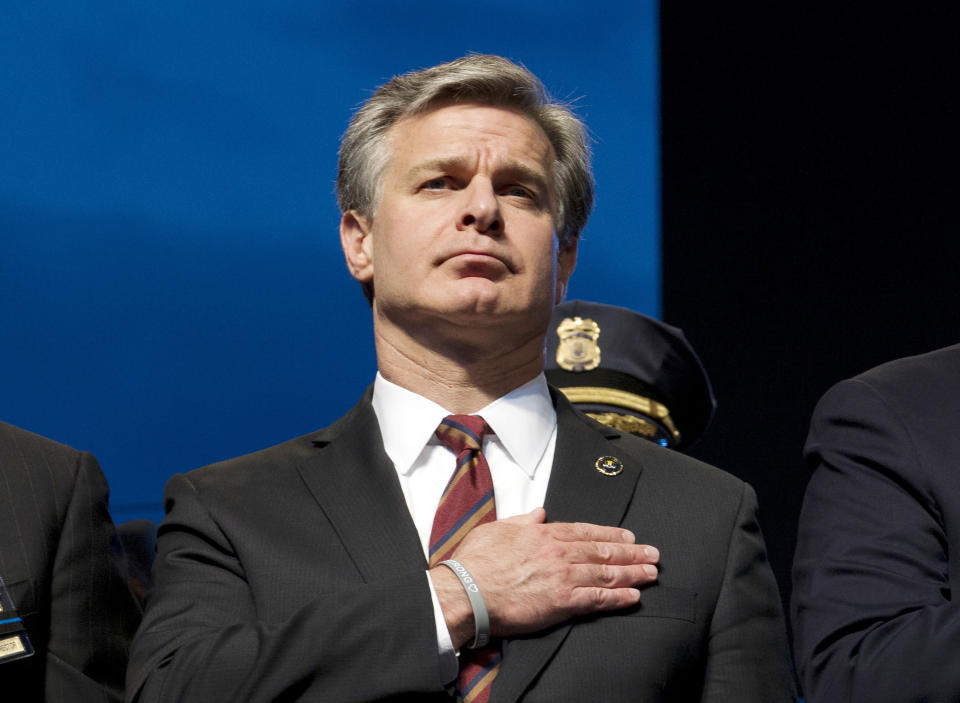 FILE - In this May 13, 2019, file photo, FBI Director Christopher Wray attends the National Law Enforcement Officers Memorial Fund Annual Candlelight Vigil to commemorate new names added to the monument, during a ceremony at the National Mall in Washington. Wray is set to testify before a Senate committee in what could be a preview of the questioning special counsel Robert Mueller may face on Wednesday, July 24, 2019. (AP Photo/Jose Luis Magana, File)