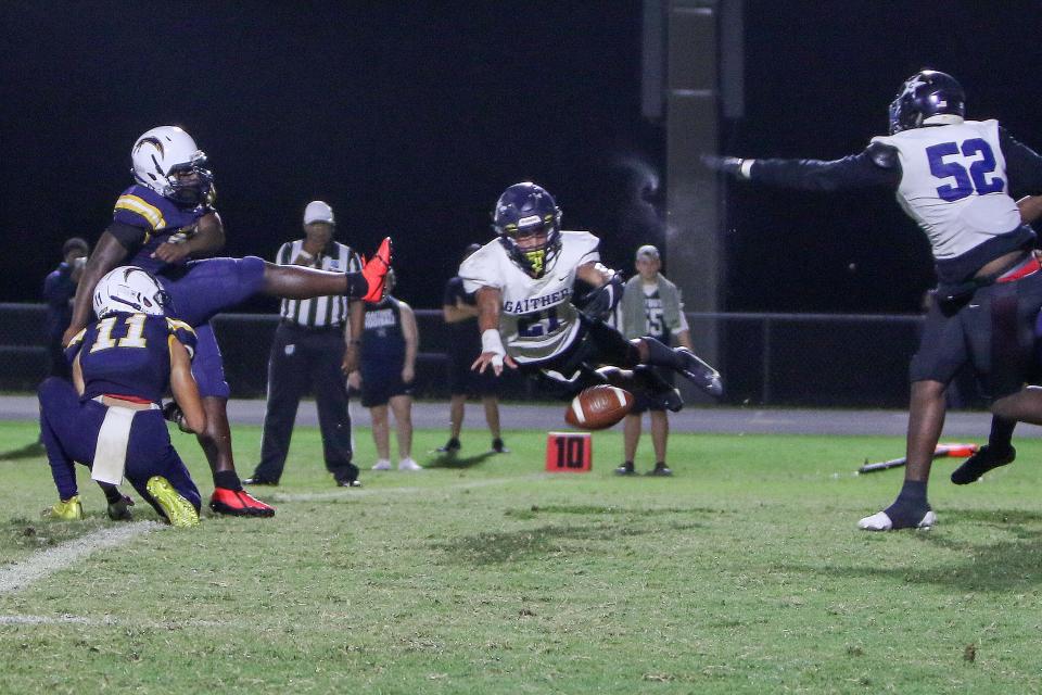 GaitherÕs Eugene Wilson flies in from the side and blocks the Lightning extra point. Action as Lehigh beat Gaither in their first round playoff game 27-0. 