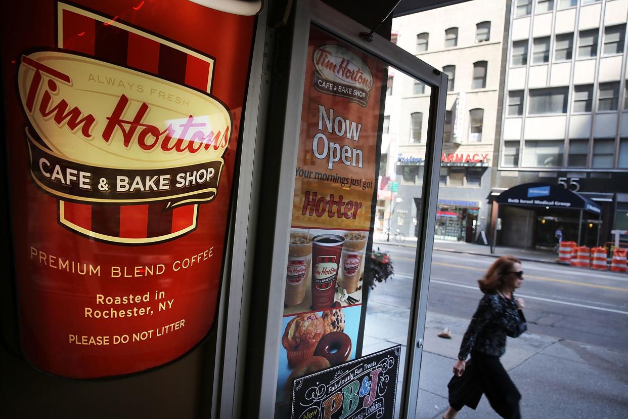 person walks past a Tim Horton's cafe in Manhattan