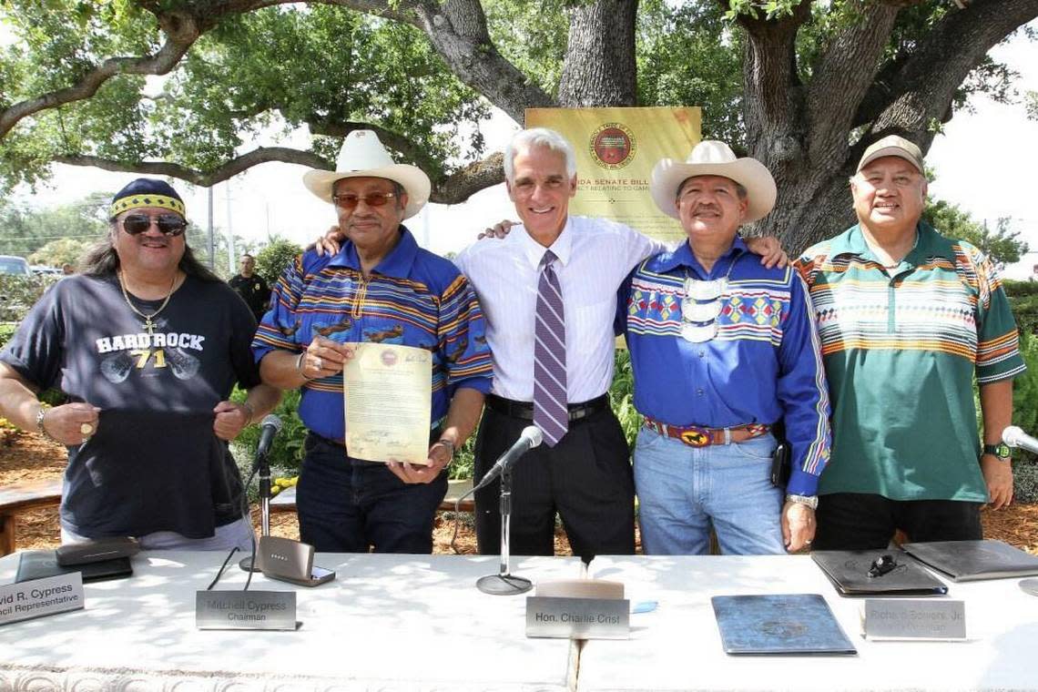 The Seminole Tribe hosted then-Governor Charlie Crist, state Rep. Bill Galvano and other dignitaries at the historic Council Oak tree on tribal land near Hollywood to celebrate the signing of the first compact in 2010. Pictured here (with their roles then): Mitchell Cypress (Chairman, Seminole Tribe of Florida), Richard Bowers (Vice Chairman, Seminole Tribe/President of Seminole Tribe Inc.), Max Osceola (Hollywood Council Representative for the Seminole Tribe of Florida), James Allen (CEO, Seminole Gaming/Chairman of Hard Rock International), with Crist (center) on May 5, 2010.