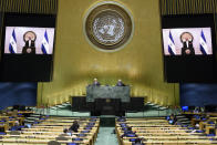 In this photo provided by the United Nations, Nayib Armando Bukele, president of El Salvador, is shown on video monitors as he speaks in a pre-recorded video message, during the 75th session of the United Nations General Assembly, Tuesday, Sept. 29, 2020, at UN headquarters. (Loey Felipe/UN Photo via AP)