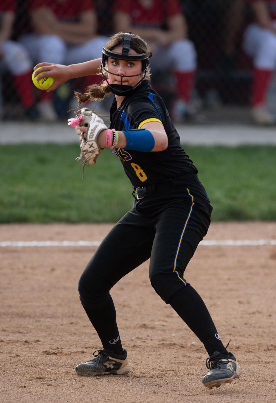 Castle's  Sadie Winsett (8) throws to first base for a Tecumseh out during their game at Tecumseh High School Wednesday evening, May 10, 2023. Castle won the game 7-4 in extra innings.