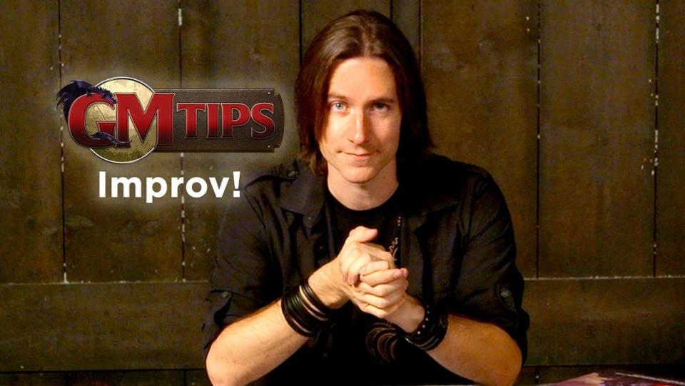 Matt Mercer sitting in front of a wall in a screenshot from GM Tips