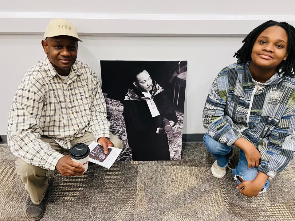 Paul and Tiara Channer post next to a portrait of Martin Luther King Jr. on Jan. 16 prior to the MLK Unity Breakfast at Blue Ridge Community College.