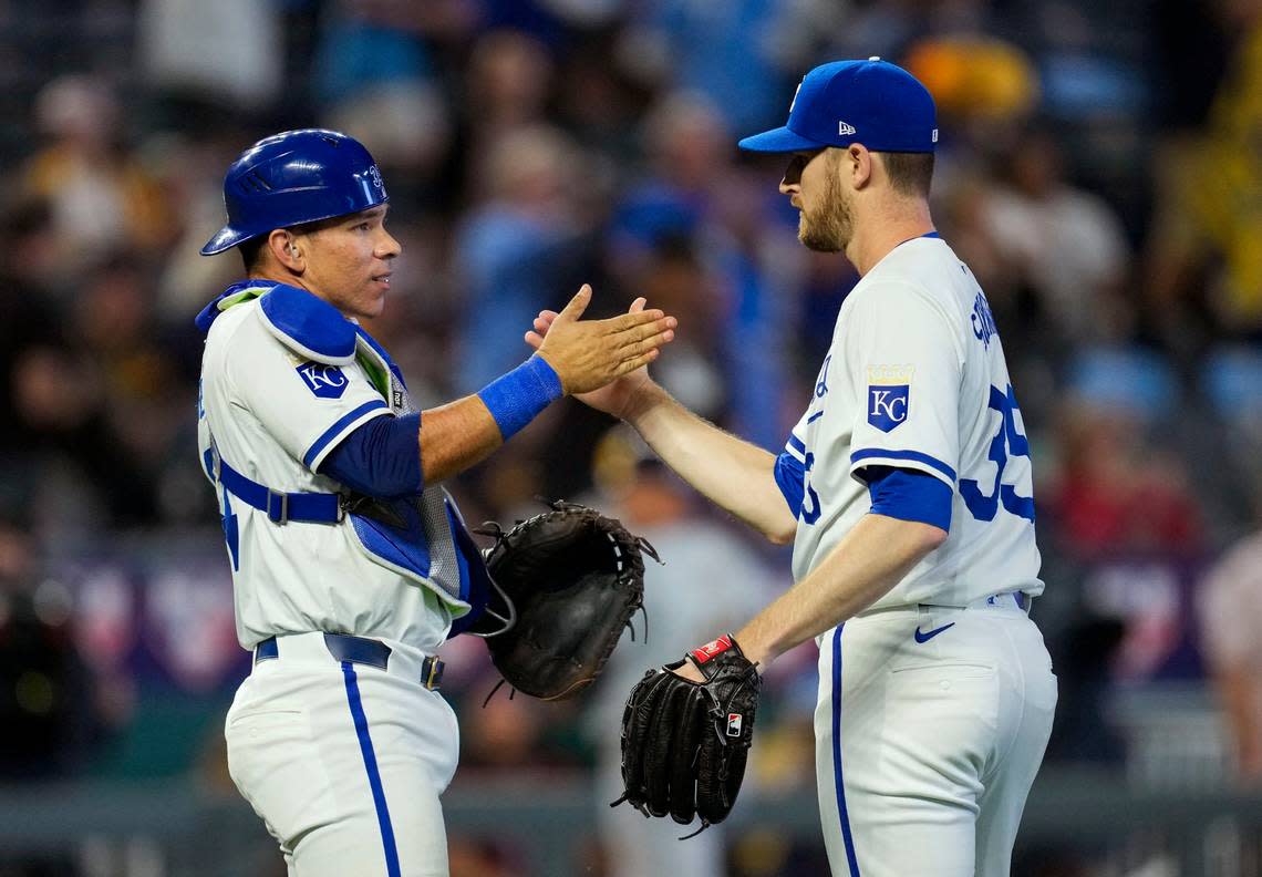 Kansas City Royals catcher Freddy Fermin, left, celebrates with pitcher Chris Stratton after Monday evening’s series-opening defeat of the Milwaukee Brewers at Kauffman Stadium. Stratton earned the save.