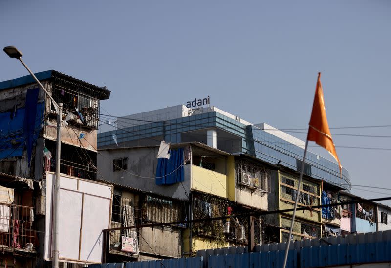 FILE PHOTO: A logo of the Adani Group is seen on a commercial complex in Mumbai