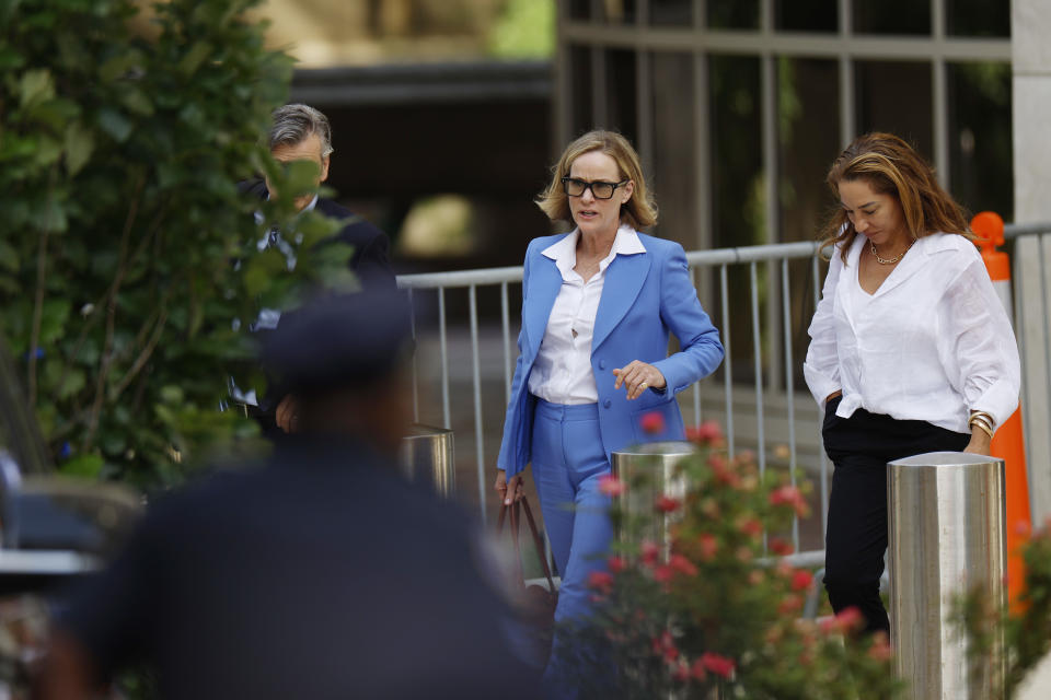 Kathleen Buhle leaves the federal courthouse in Wilmington.