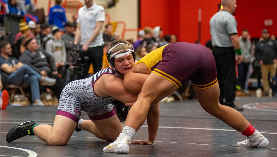 Dakota's Noah Wenzel, left, wrestles Loyola Acadamy's Kai Calcutt in the 215-pound championship match during the Dvorak Invitational Wrestling Tournament on Sunday, Dec. 16 2023, at Harlem High School in Loves Park. Wenzel was declared the winner after Calcutt was injured during the match.