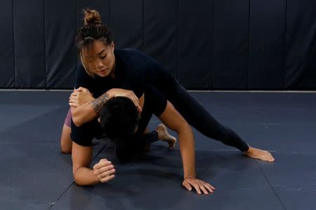 MMA fighter Angela Lee trains with her brother Christian Lee in Singapore May 18, 2017. REUTERS/Yong Teck Lim