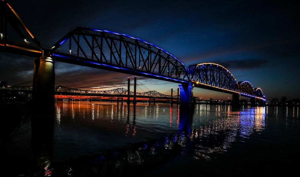 The Big Four pedestrian bridge is lighted in blue and yellow, the colors of Ukraine on Saturday, February 26, 2022