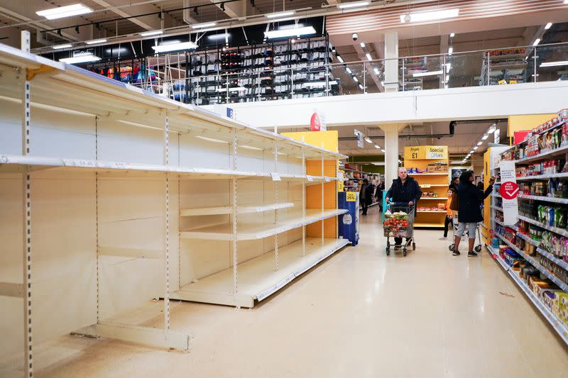 Empty shelves of toilet roll and tissue inside a supermarket, as the number of coronavirus cases grow around the world, in London