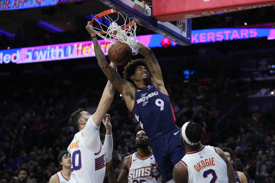 Philadelphia 76ers' Kelly Oubre Jr., center, dunks past Phoenix Suns' Jusuf Nurkic, from left, Kevin Durant and Josh Okogie during the second half of an NBA basketball game, Saturday, Nov. 4, 2023, in Philadelphia. (AP Photo/Matt Slocum)