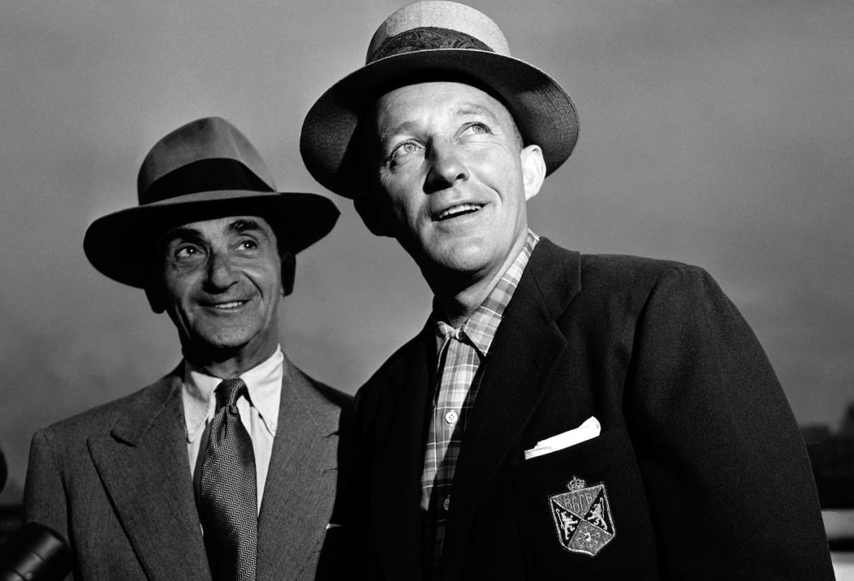 After Irving Berlin, left, penned 'White Christmas,' he pegged Bing Crosby as the ideal singer for what would become a holiday classic. <a href="https://www.gettyimages.com/detail/news-photo/american-composer-lyricist-and-songwriter-irving-berlin-and-news-photo/1296904202?adppopup=true" rel="nofollow noopener" target="_blank" data-ylk="slk:Irving Haberman/IH Images via Getty Images;elm:context_link;itc:0;sec:content-canvas" class="link ">Irving Haberman/IH Images via Getty Images</a>