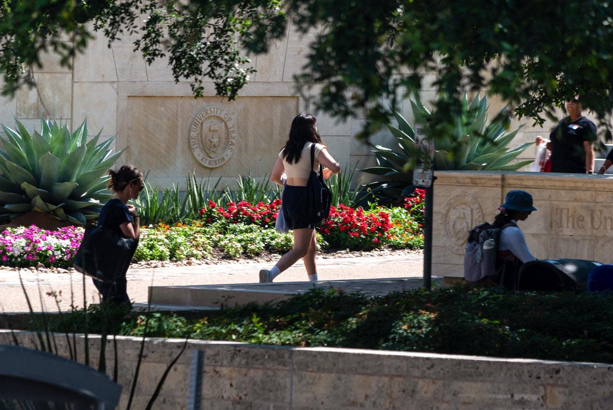 Students walk through the University of Texas campus on May 30, 2023.